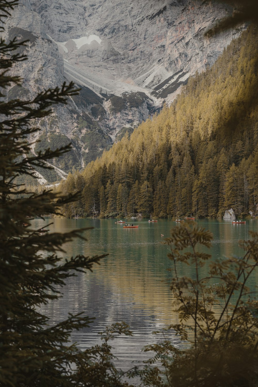 a lake surrounded by mountains and trees
