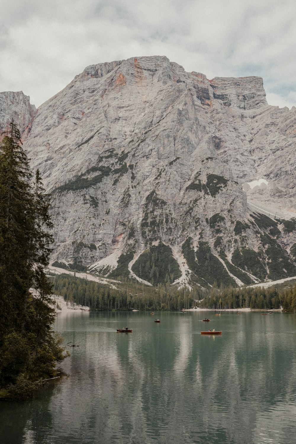 a lake surrounded by mountains and trees