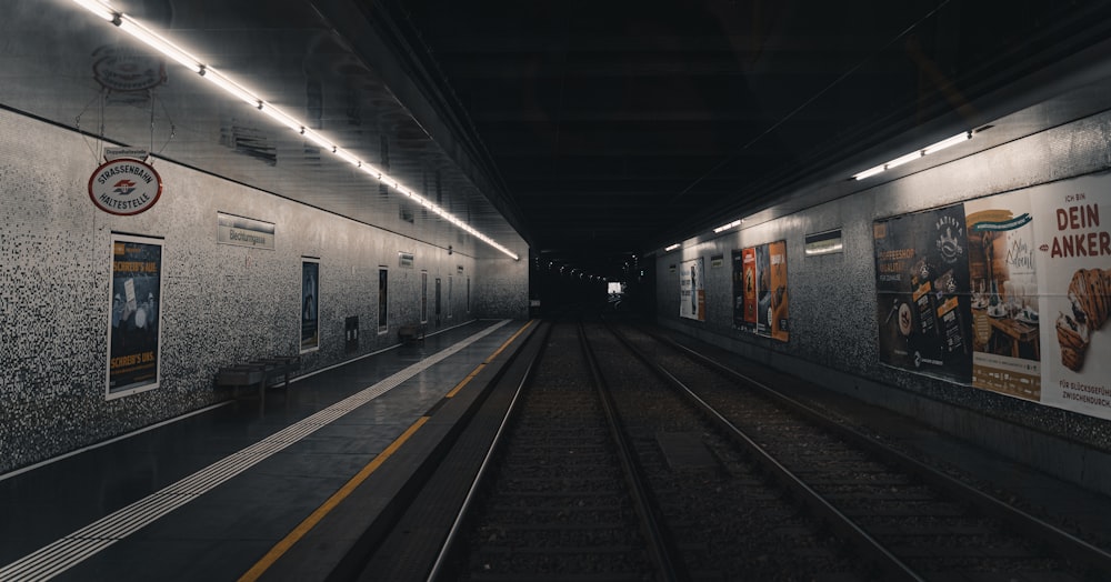 a train station with a train on the tracks