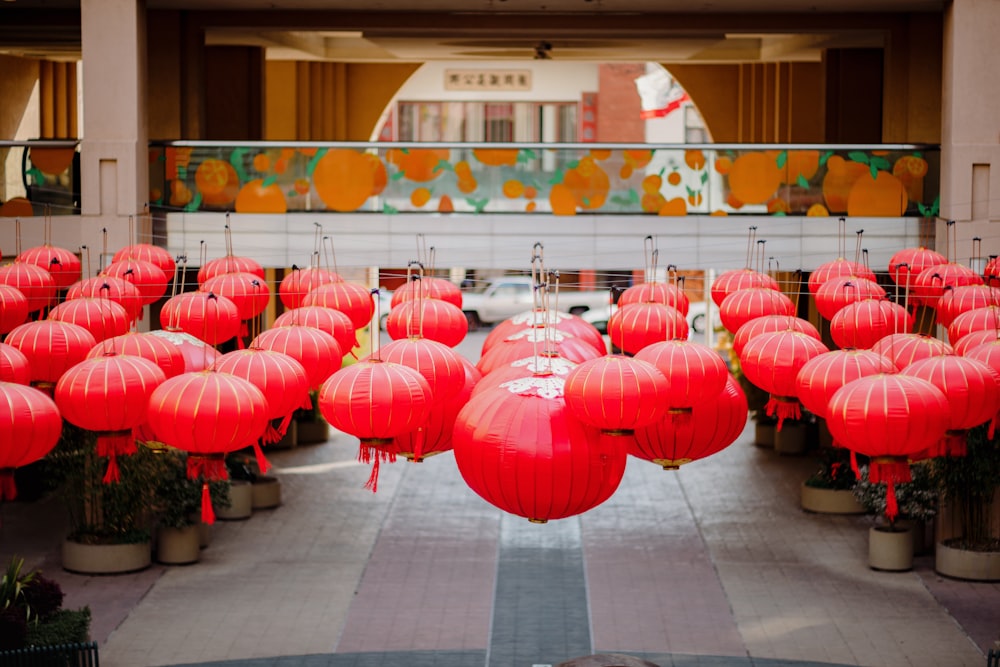 a room filled with lots of red lanterns