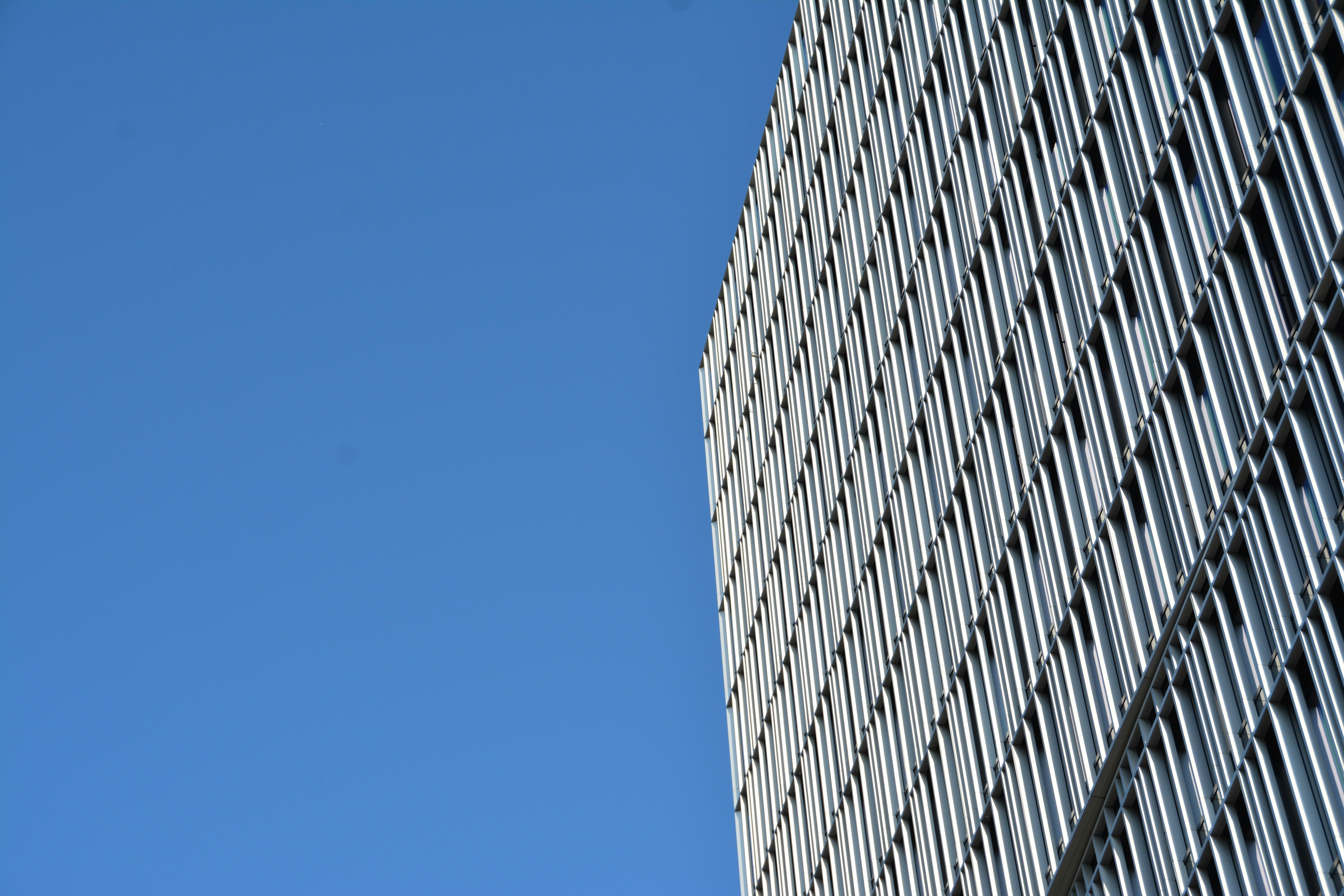 a very tall building with a sky in the background