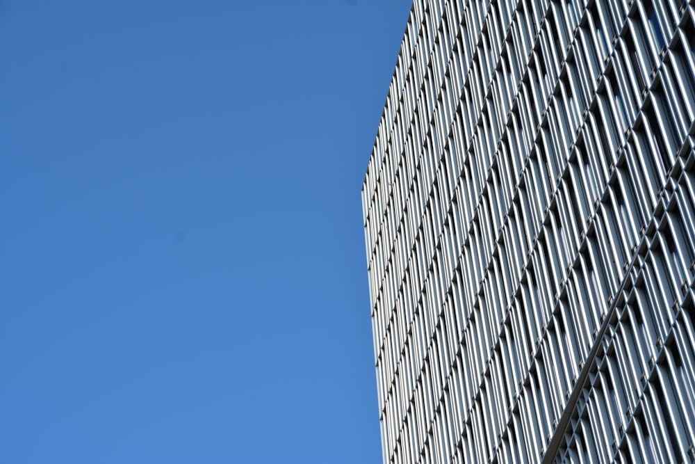 a very tall building with a sky in the background