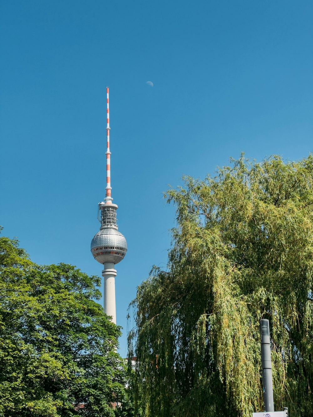 a tall tower with a sky scraper on top of it