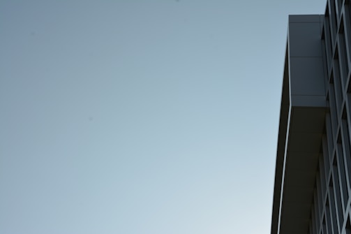 A minimalist architectural shot emphasizing dark lines and golden accents.