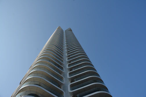 a tall building with a sky background