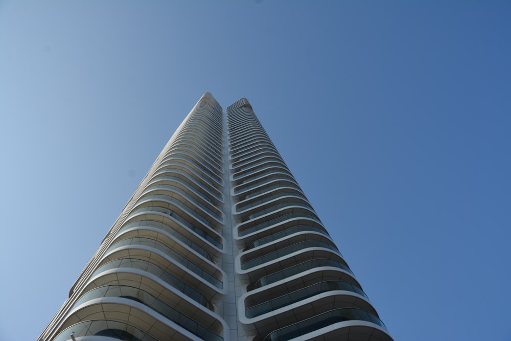 a tall building with a sky background