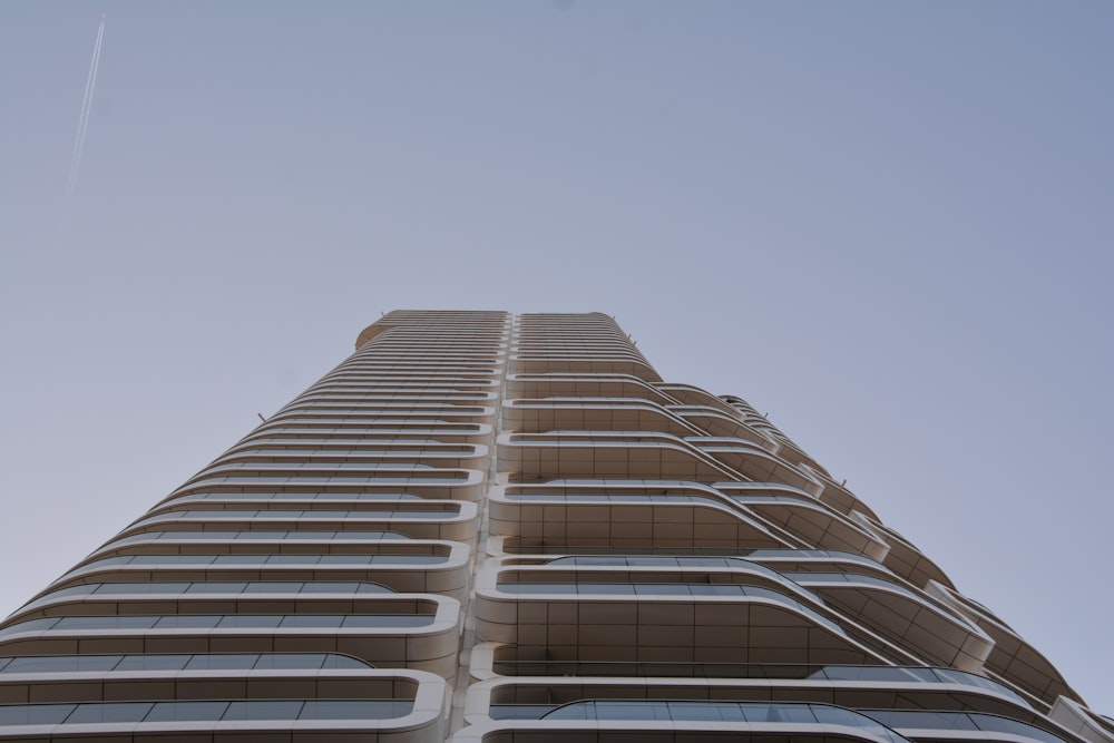 a tall building with a sky background