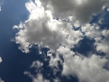Close-up of delicate cloud shapes against a serene sky background.