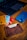 A close-up of a wallet on a wooden table with cards.