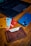 A close-up of a sleek, modern prepaid card resting on a wooden table.