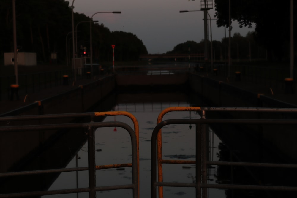 a view of a waterway at dusk from a bridge