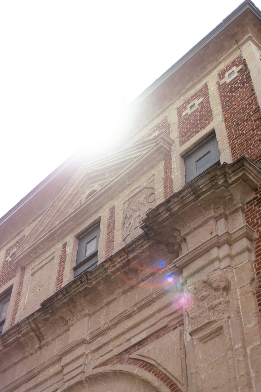 the sun shines brightly through the windows of a building