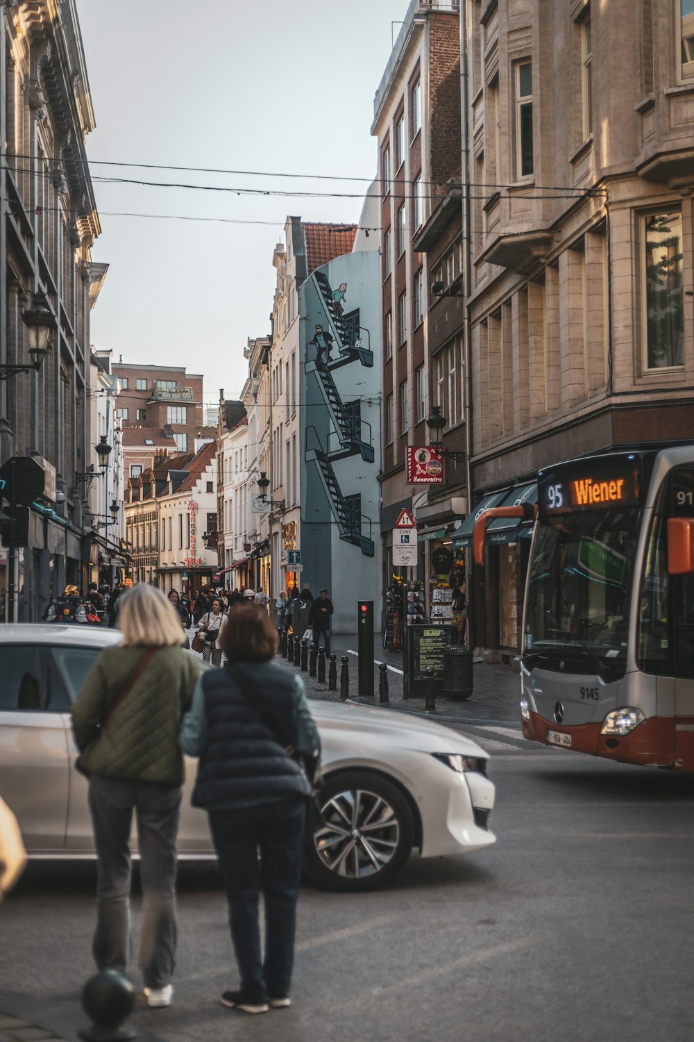 a couple of people that are standing in the street