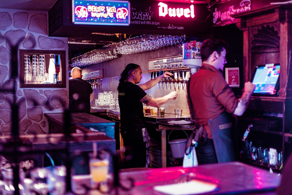 a couple of people that are at a bar