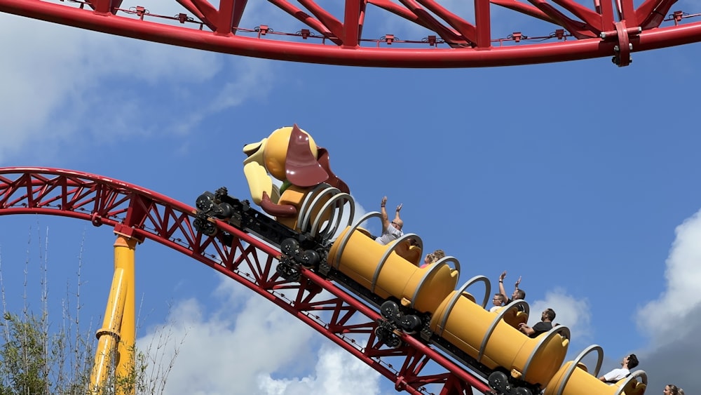 a roller coaster with people riding on it