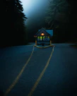 A sturdy wooden guard hut standing guard at a rural property entrance.