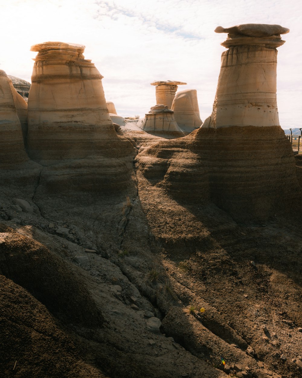 a large rock formation in the middle of a desert