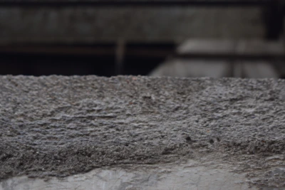 Close-up of freshly poured concrete surface smoothing on an industrial floor.