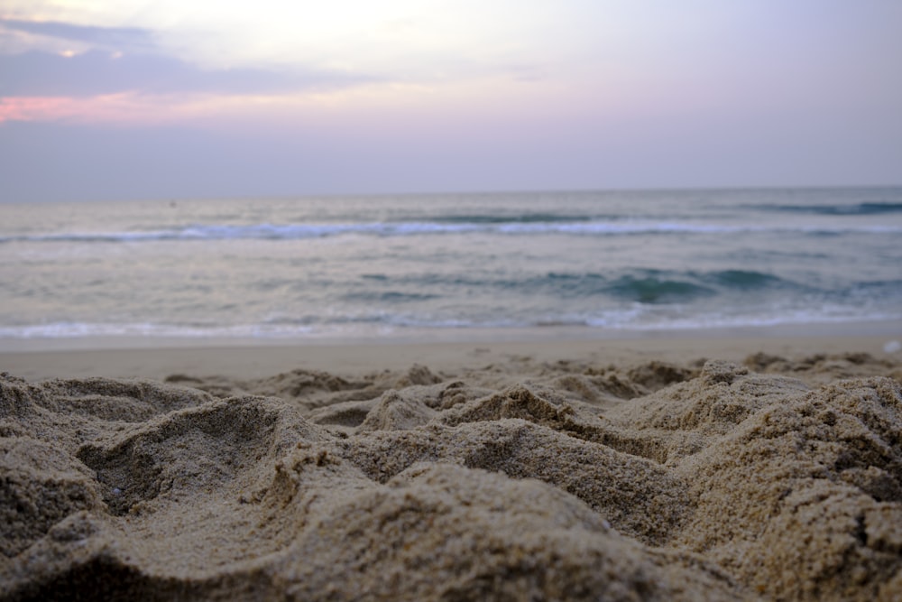 a view of the ocean from a sandy beach