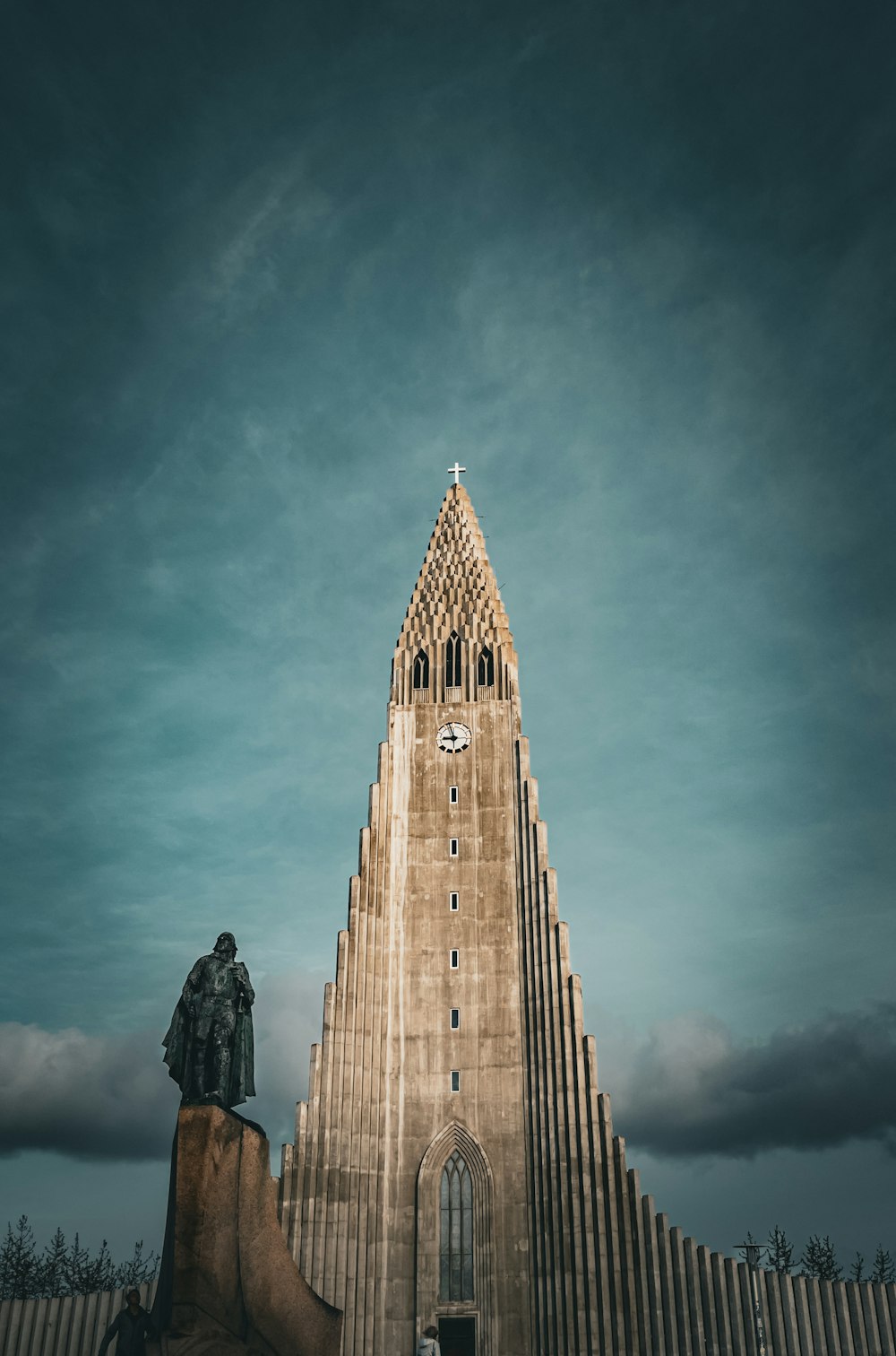 a tall tower with a clock on the top of it