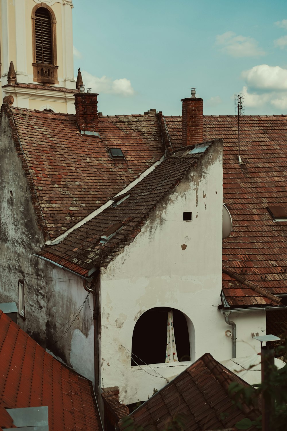 an old building with a clock tower in the background