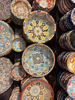 A variety of colorful ceramic bowls arranged on a table.