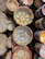 Brightly colored ceramic bowls stacked neatly on a rustic wooden table.