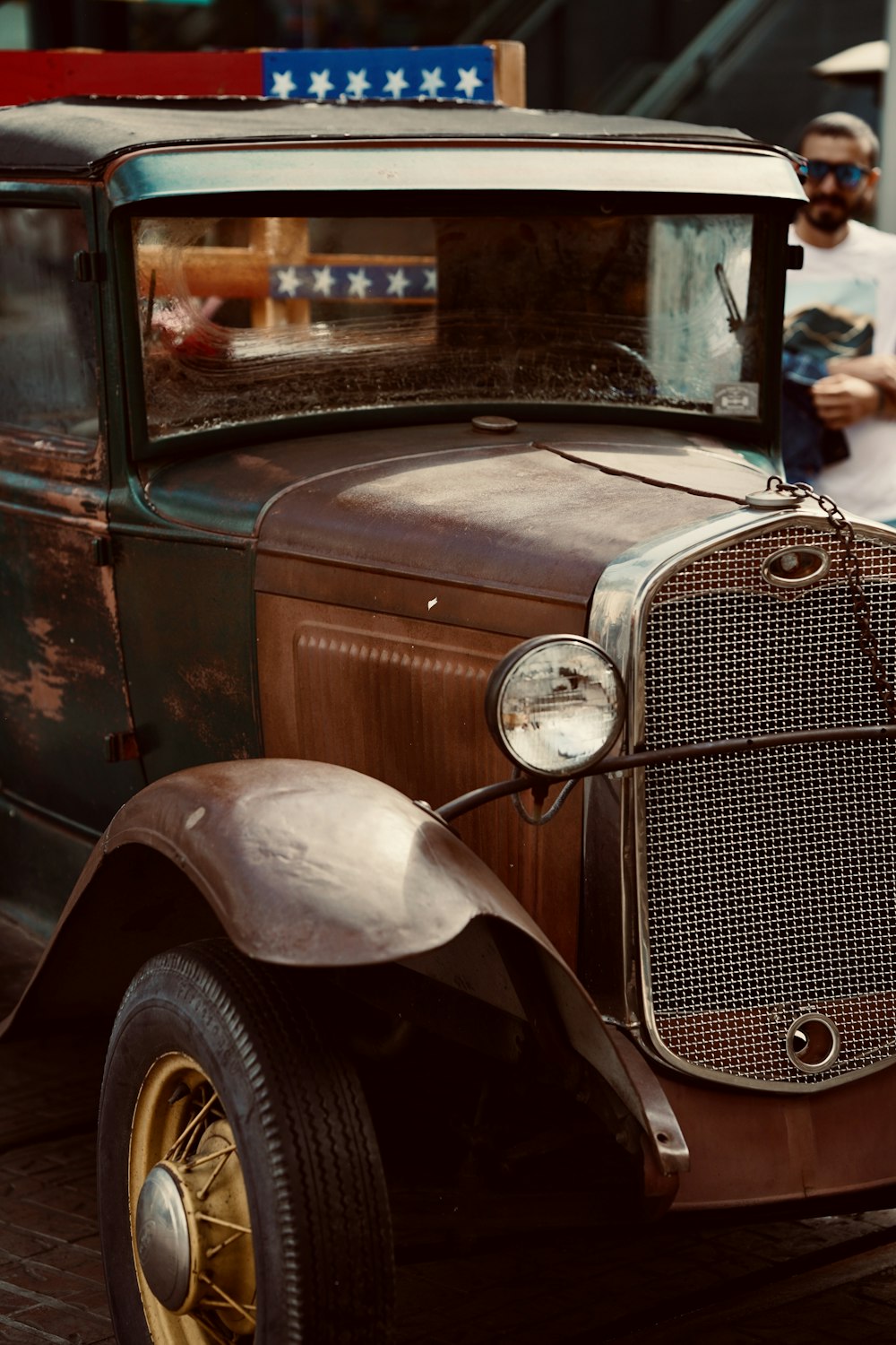 an old car parked on the side of the road