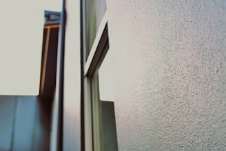 Close-up of a textured wall print showing intricate details of a cityscape at dusk