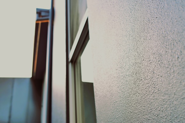 Close-up of a textured wall print showing intricate details of a cityscape at dusk