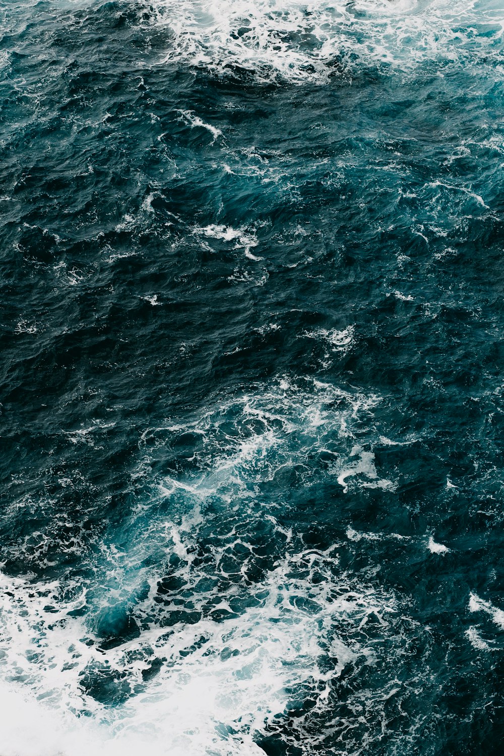 a large body of water surrounded by waves