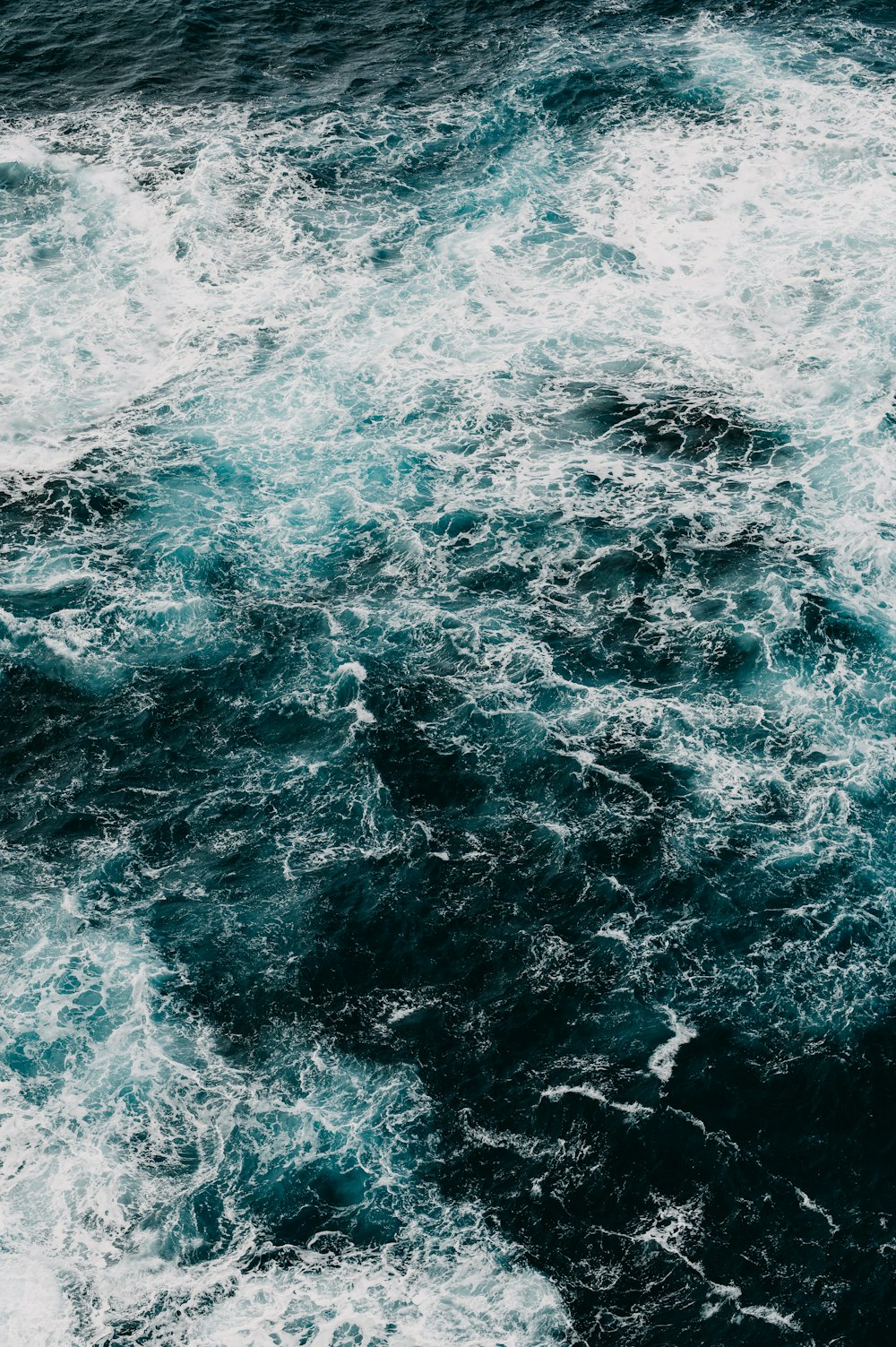 a large body of water surrounded by waves