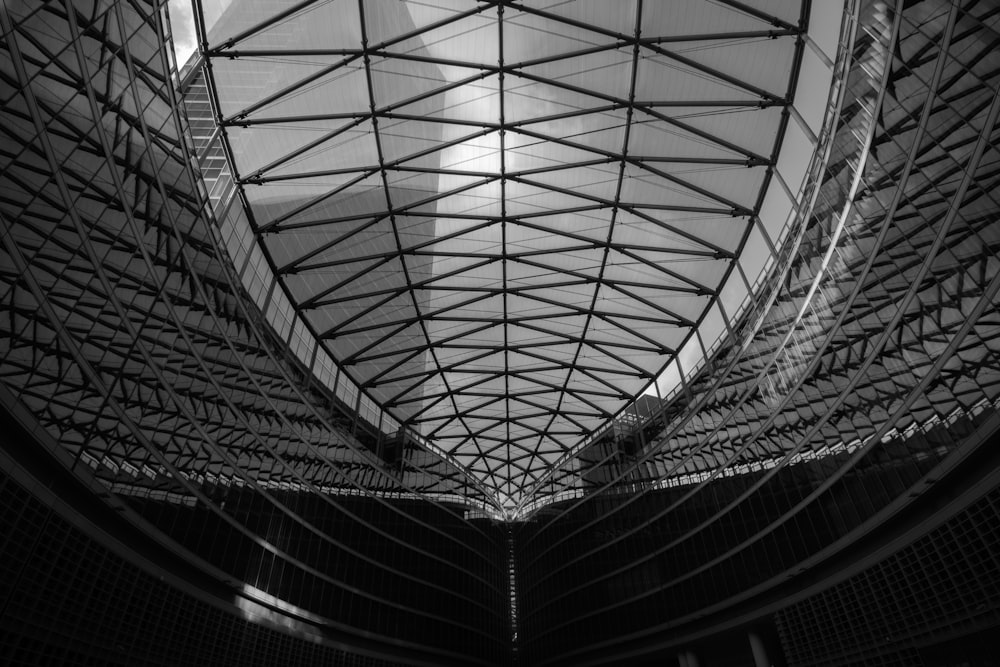 a black and white photo of a ceiling in a building