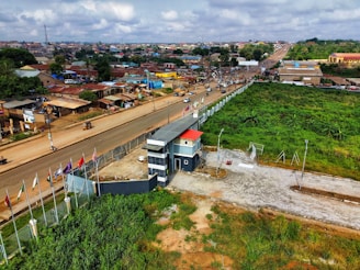 Aerial view of a gated community with security checkpoints.