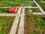 an aerial view of a farm with a red roof