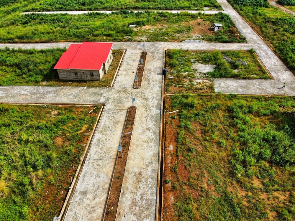 an aerial view of a farm with a red roof