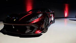 A sleek black and red VIP kit package glowing against a dark background.