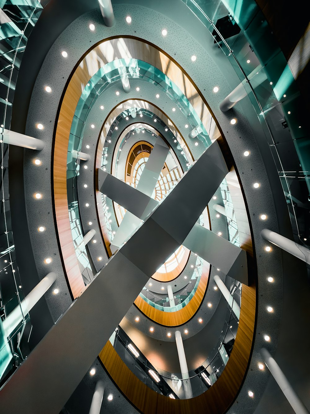 a spiral staircase in a building with lights