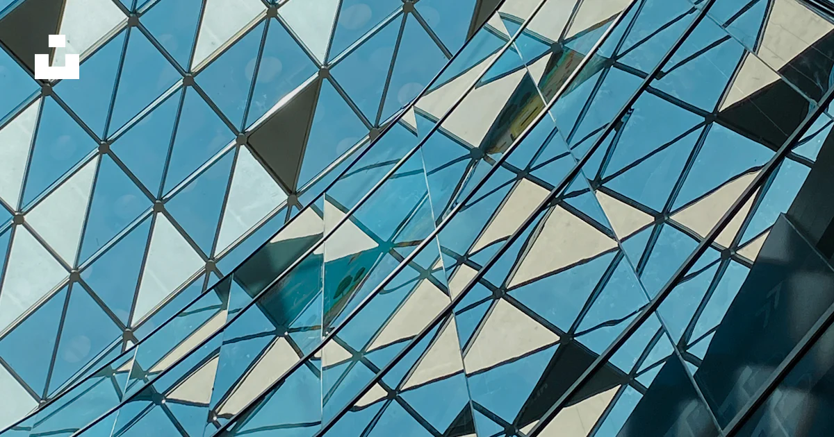 Building Texture Skylight A large glass building with a skylight in the background photo – Free ...
