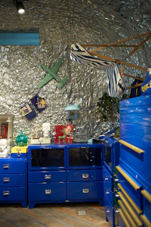 A row of colorful painted cabinets showcasing different design trends