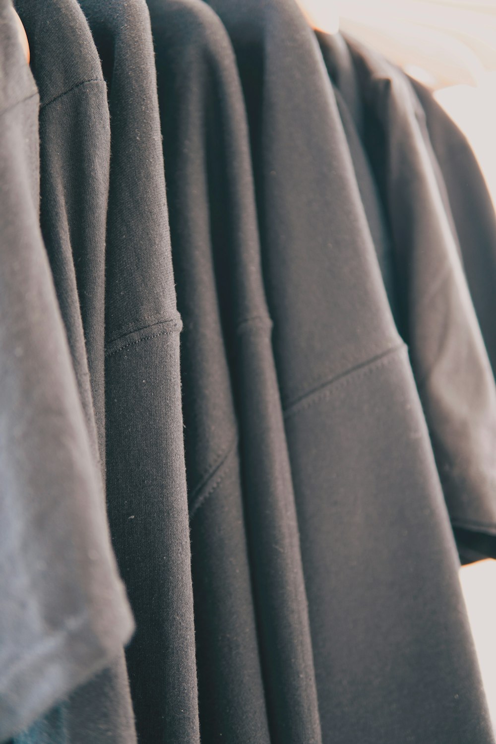 a row of shirts hanging on a clothes rack