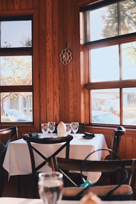 a restaurant with wooden walls and tables and chairs