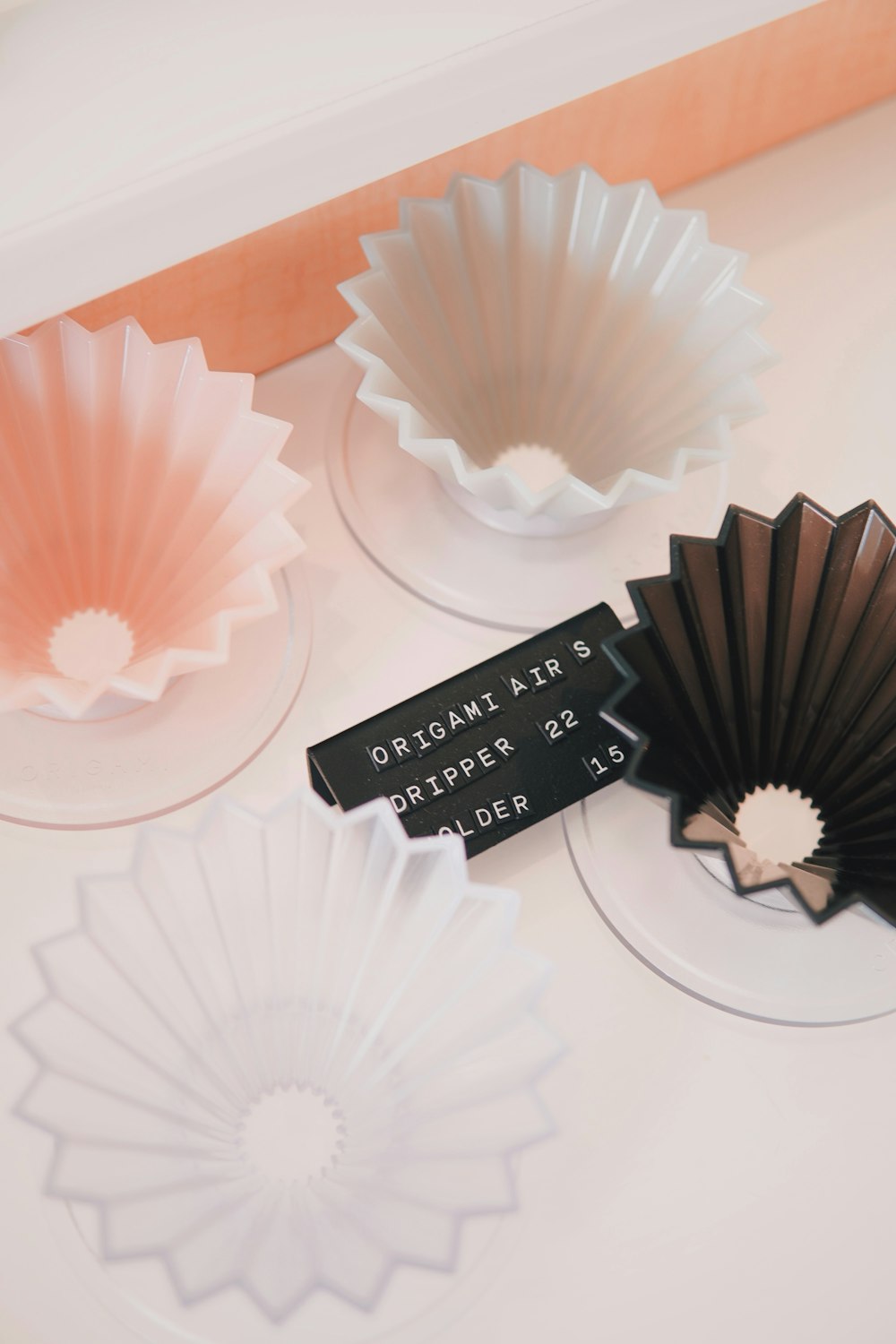 a couple of paper fans sitting on top of a table