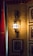 A happy customer showcasing Anjelicas wall sconces in her living room.