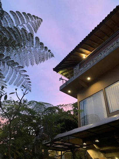 A vibrant 3D rendering of a modern home surrounded by lush greenery at sunset.