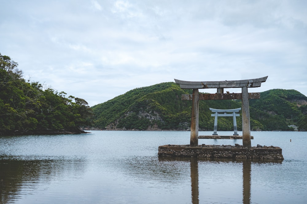 a large body of water with a wooden structure in the middle of it