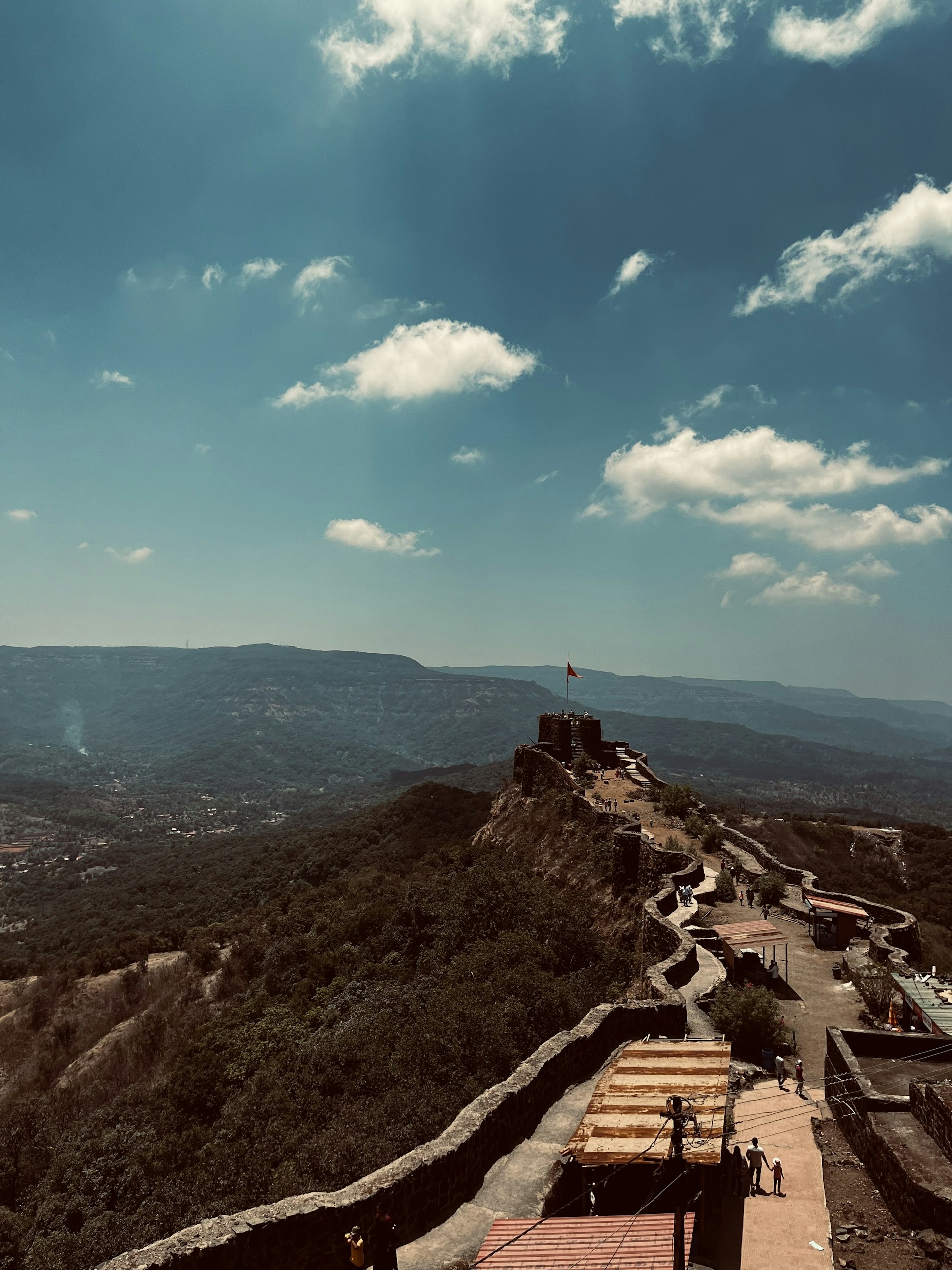 a scenic view of a mountain with a sky background