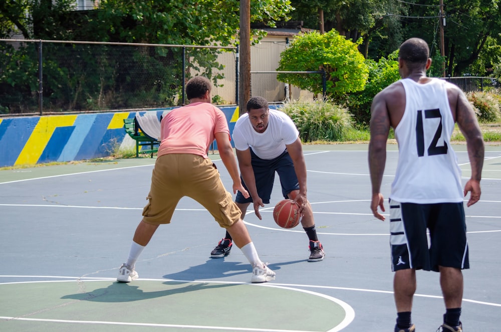 a group of men playing a game of basketball