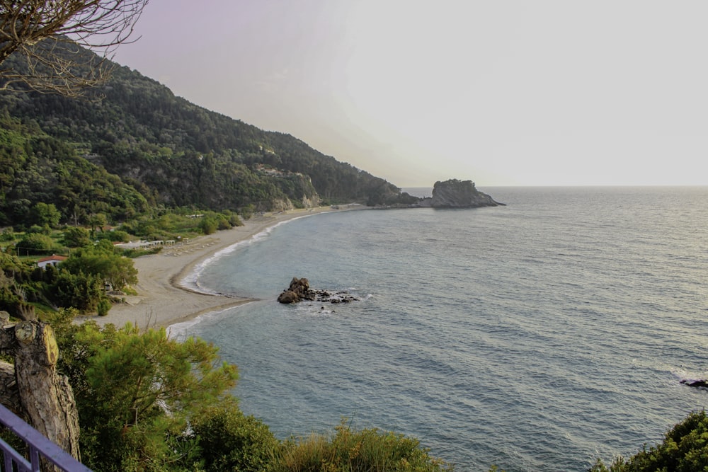 a view of a beach from a cliff