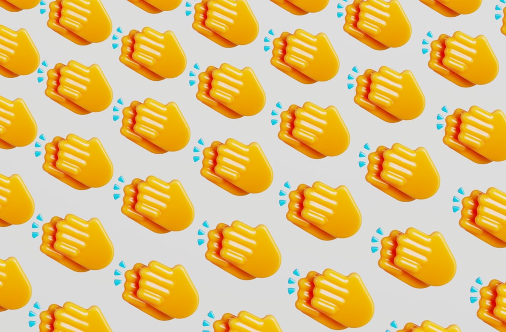 a bunch of yellow objects on a white background